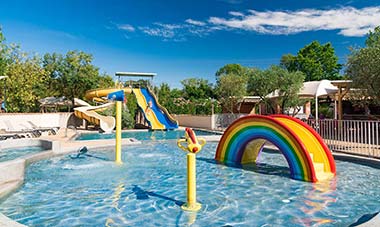 Paddling pool and water slides at Les Rivières campsite in Canet in Hérault