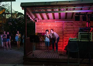 Children during a karaoke night at the campsite near Salagou