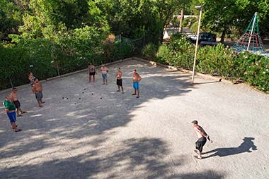 Game of petanque on the bowling alley of the campsite near Agde