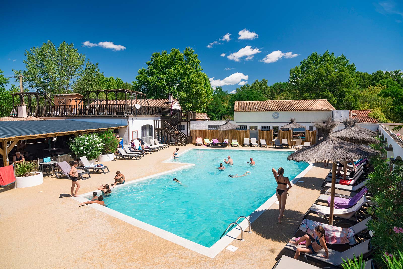 View of the swimming pool at Les Rivières campsite near Salagou