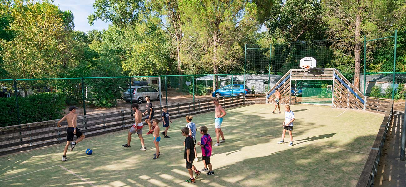 Young people on the multisports ground of the campsite near Salagou in Canet in Hérault